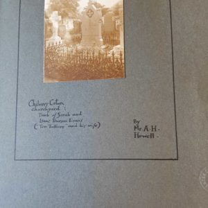 Black and white photograph of a graveyard with the title Chilvers Coton Churchyard. Mounted on blue/grey card.