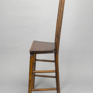 Side view of a wooden chair.