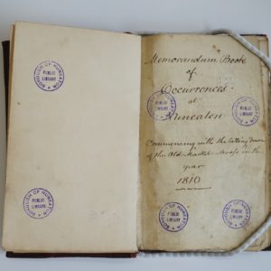 Book open at first page. Handwritten text reads: 'Memorandum book of occurrences at Nuneaton. 1810.