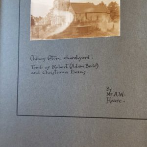 Black and white photograph of the side view of a church with the title Chilvers Coton churchyard. Mounted on blue/grey card.