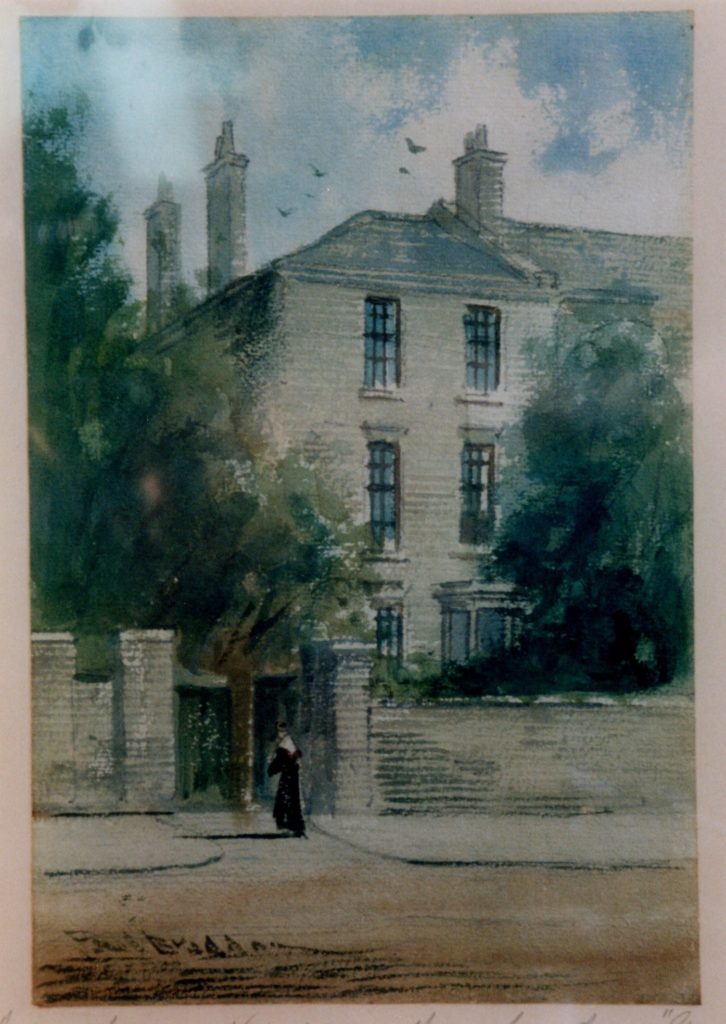 Watercolour painting. Part of a large house is shown with three chimneys and six windows. There are trees to the right and left of the house. A wall surrounds the front of the house and a figure can be seen near to the gateway. There is a blue sky with clouds and birds flying overhead.