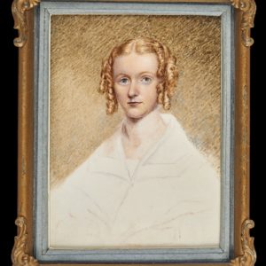 Painting of a woman with side ringlets dressed in white. In gilt brass (gilt now missing) frame.